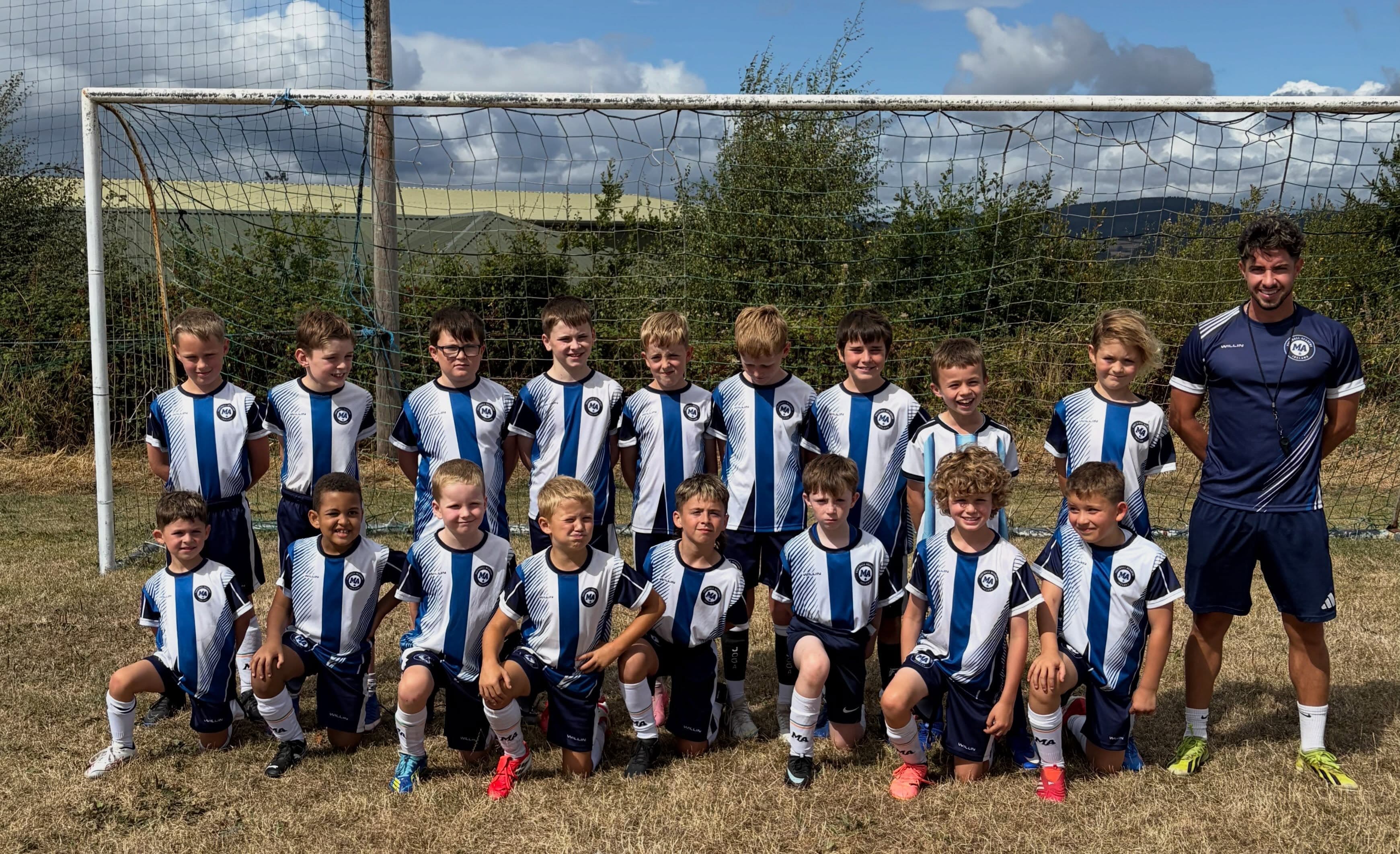 M&A Football Academy squad with coaches