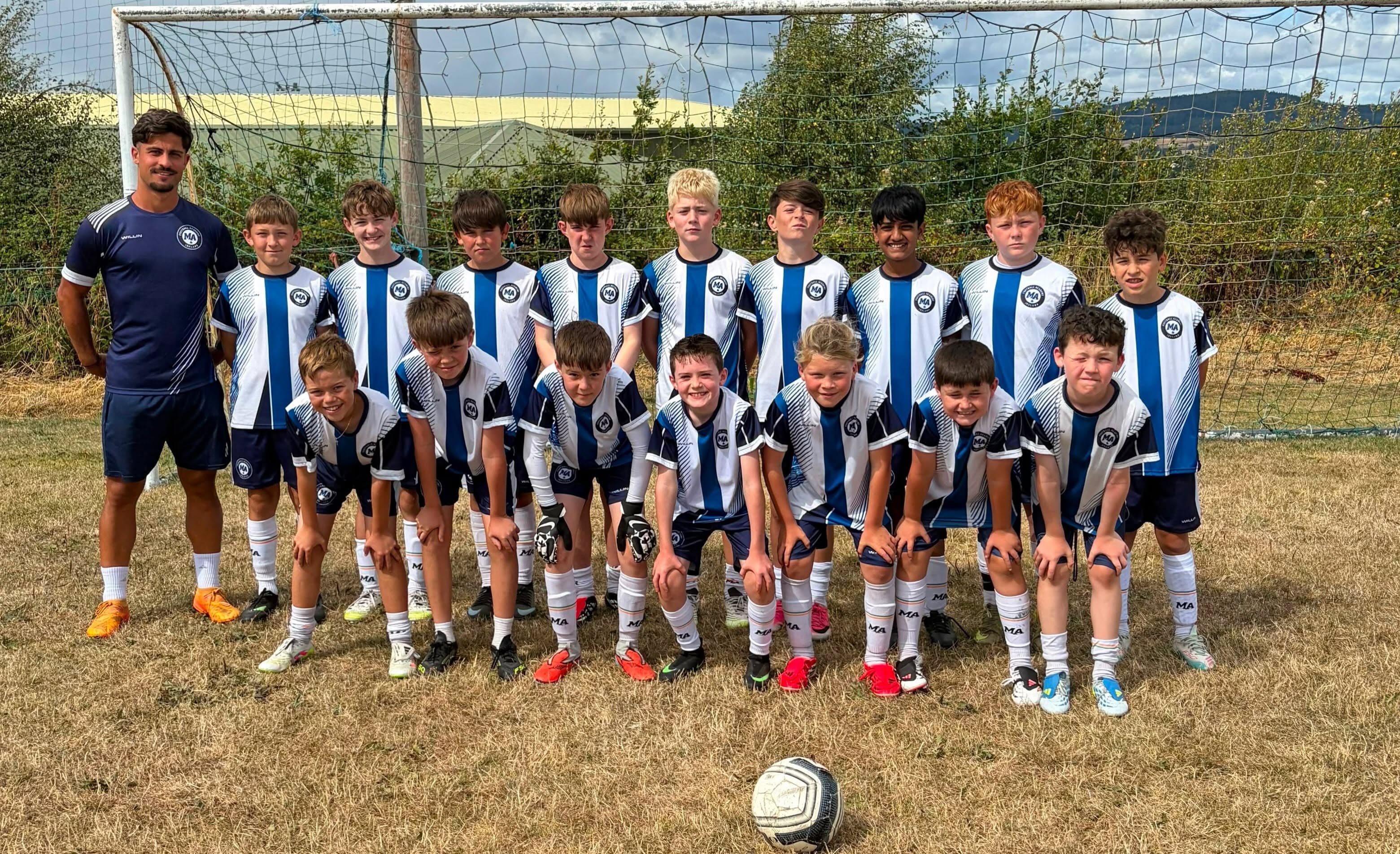 M&A Football Academy players and coaches on the pitch